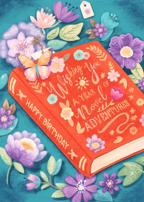 Illustrated red hardcover book with gold text reading Wishing You the Most Novel Adventure surrounded by colorful watercolor flowers on a teal background